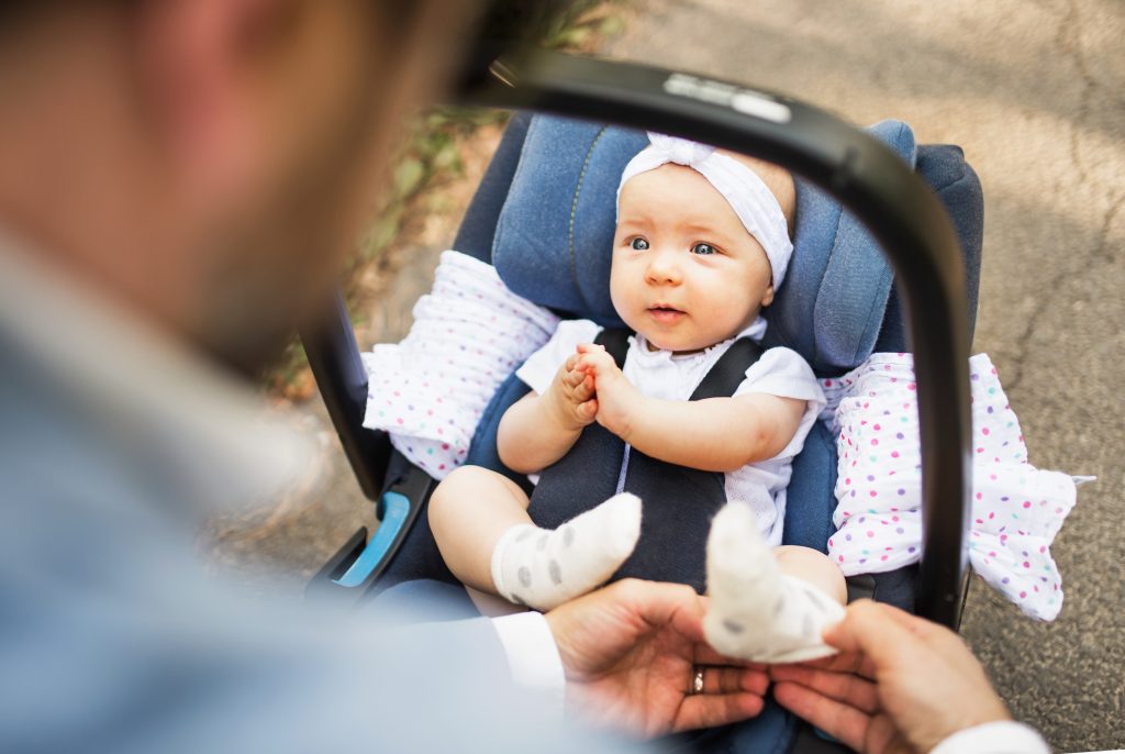 father-with-baby-daughter-sitting-in-car-safety-se-2023-11-27-05-33-21-utc