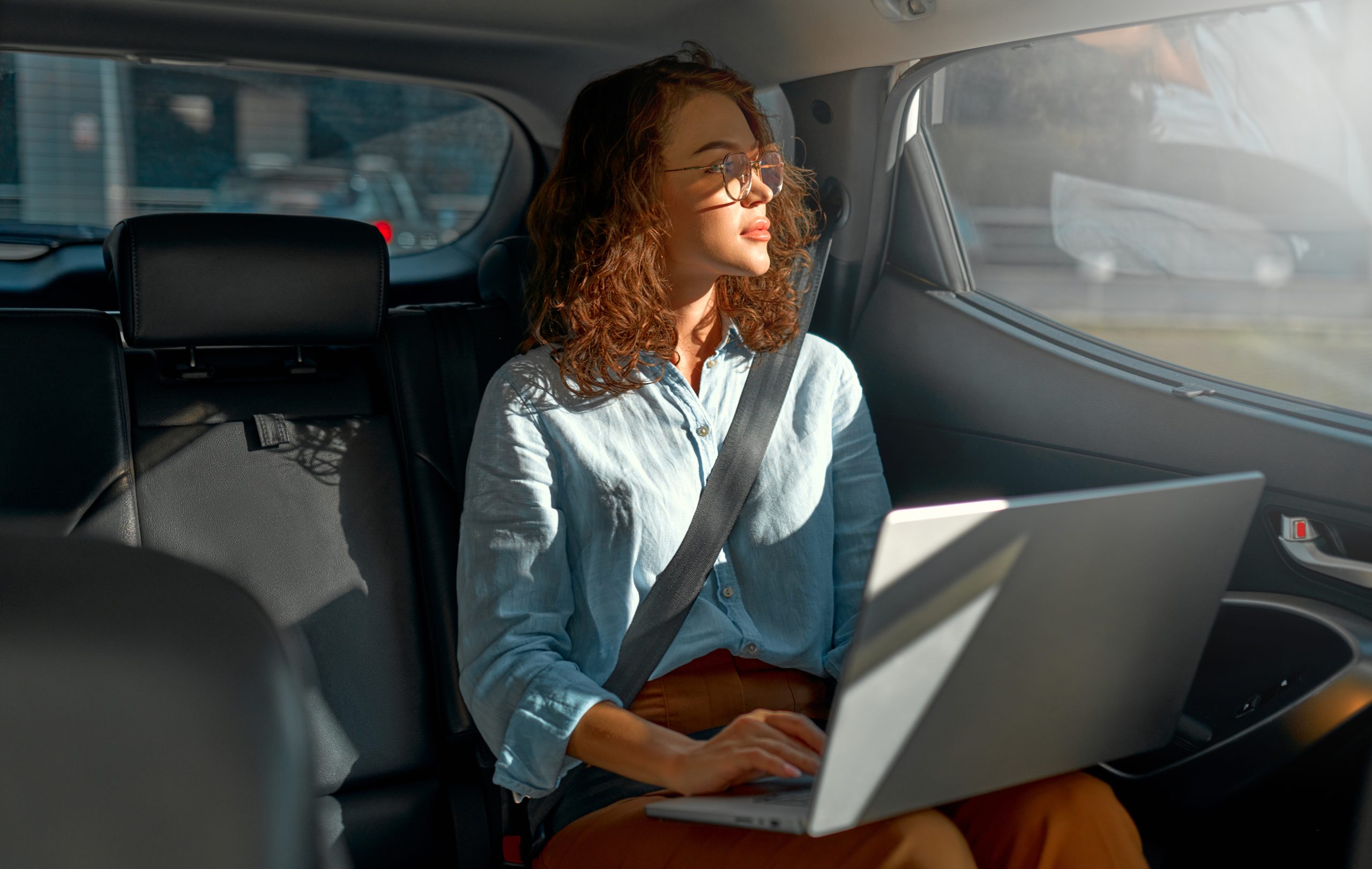 businesswoman-sitting-in-car-2023-12-06-02-30-02-utc